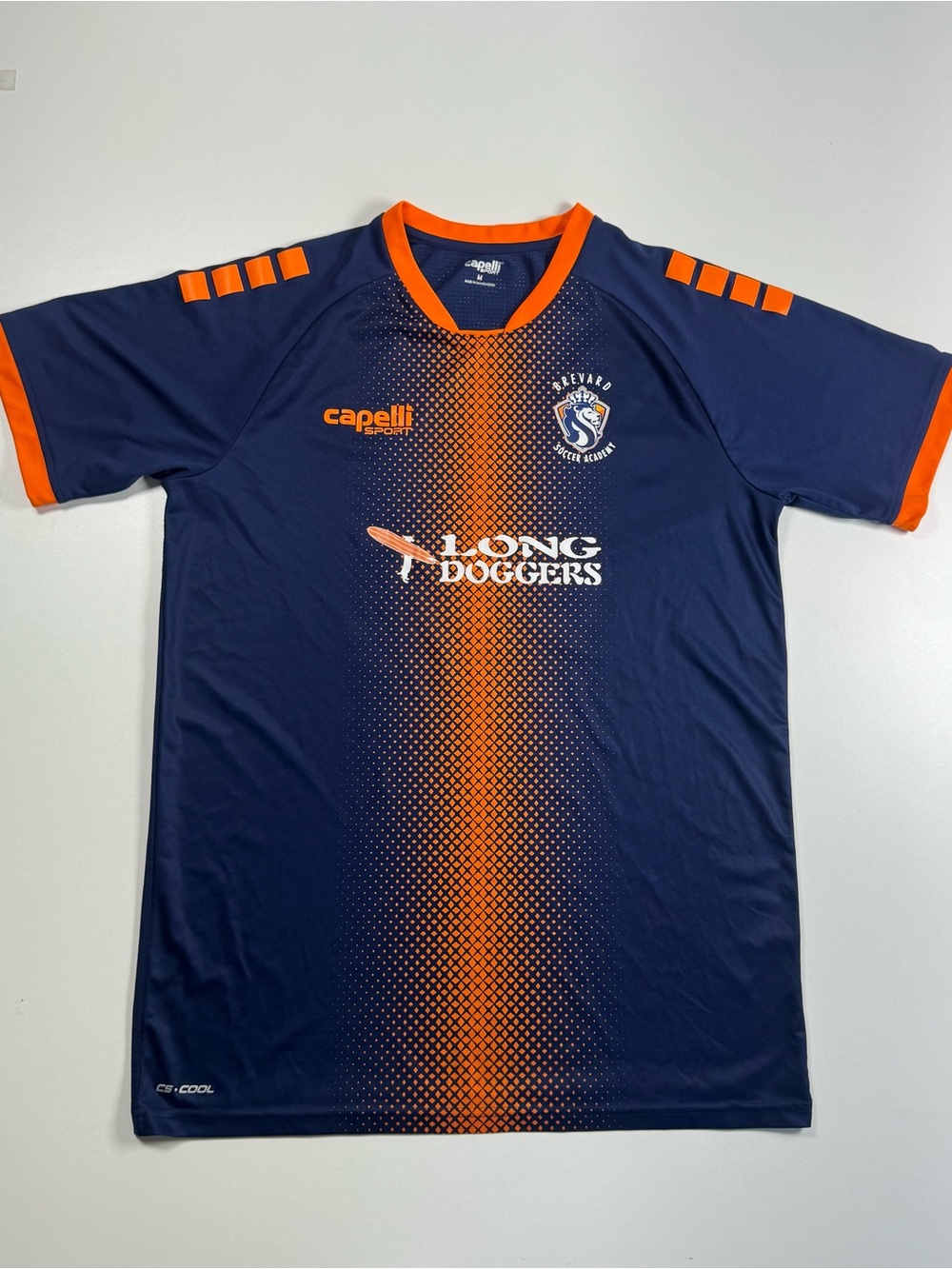 Capelli of New York Navy and Orange Brevard Soccer Jersey